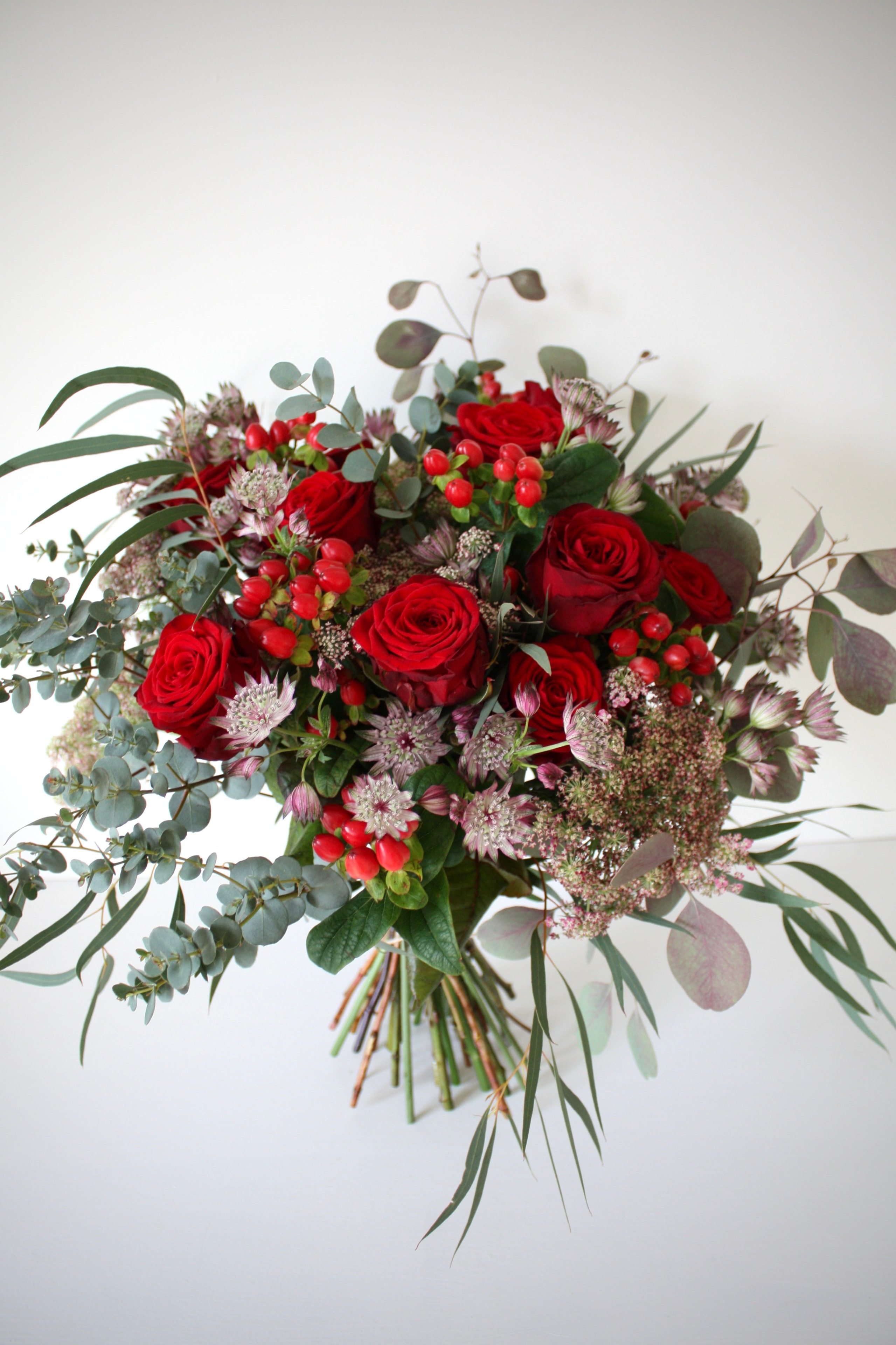 Red rose and astrantia bouquet
