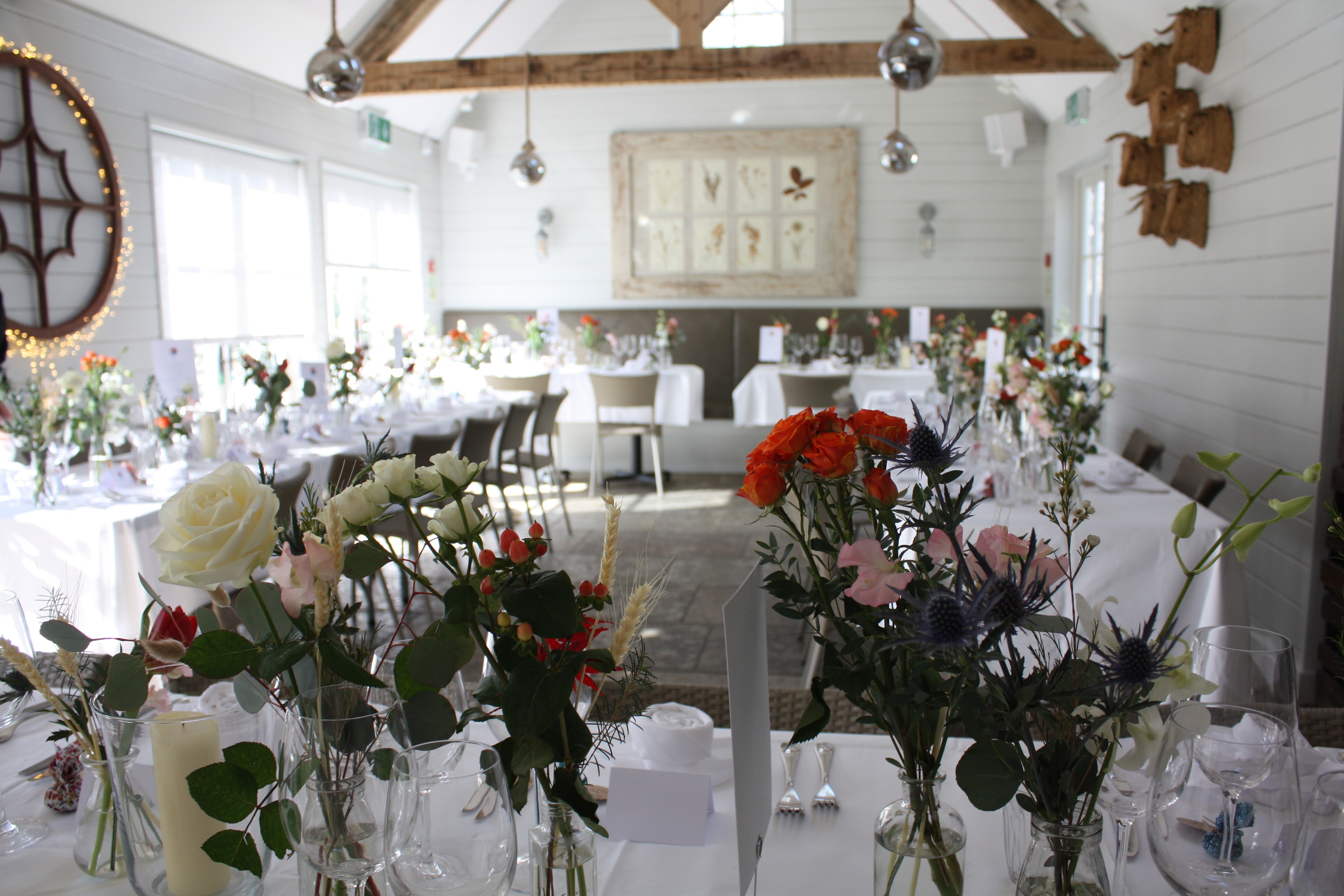 Barn venue with wildflower centrepieces